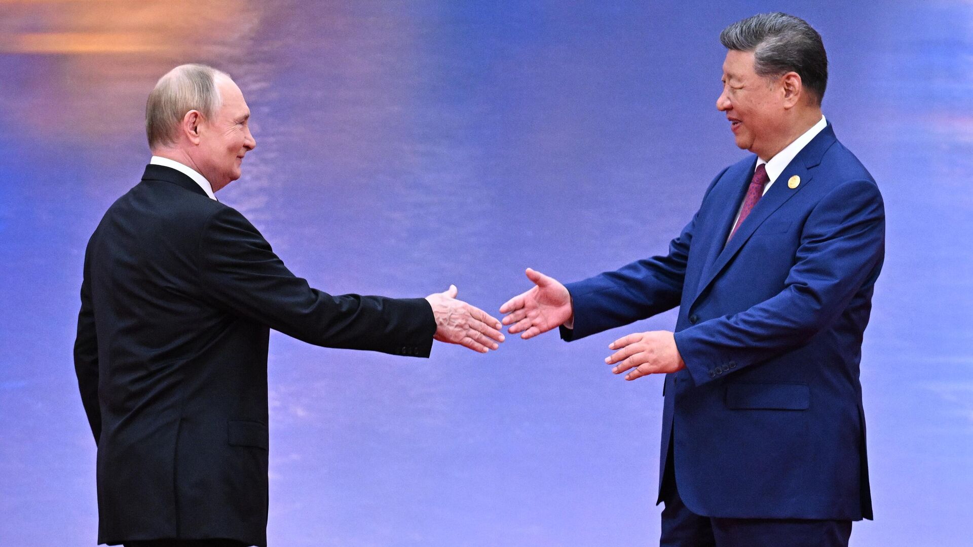Putin Xi Handshake